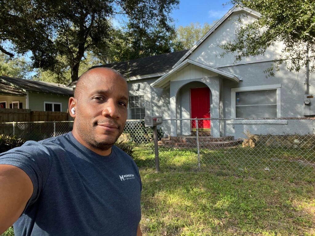 Jacksonville FL Realtor Top Agent Chris Moore with lockbox to rental property